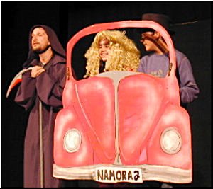 Brad and Janet driving their car